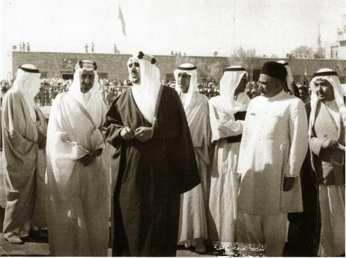 AT JEDDAH WITH CROWN PRINCE OF SAUDI ARABIA, PRINCE AL-FAISAL BIN ABDUL AZIZ (ON THE LEFT) AND KING AL-SAUD BIN ABDUL AZIZ (IN THE MIDDLE) AND CHAUDHARY ALI AKBAR KHAN IN SHERWANI